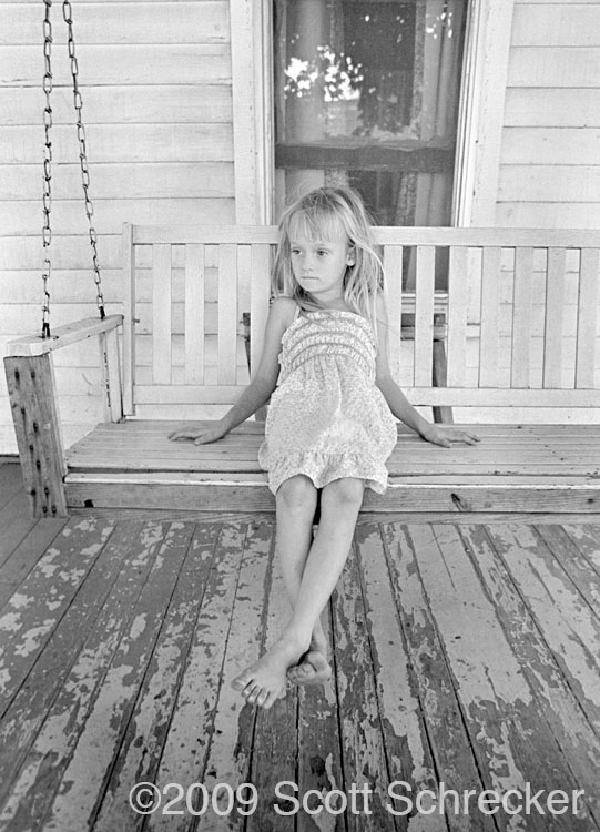 Girl on Porch Swing